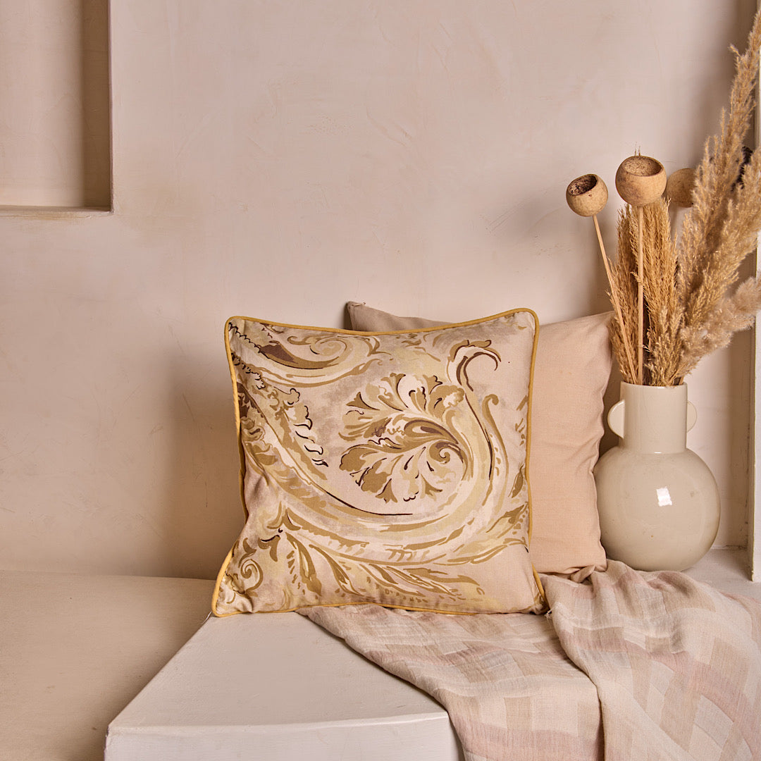 Luxury beige cushion cover featuring hand-drawn botanical motifs, inspired by natural textures.