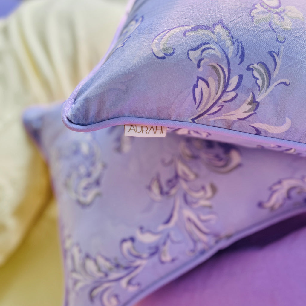 Aurahi Pankti cushion cover — modern pastel design blending lavender and misty green details.