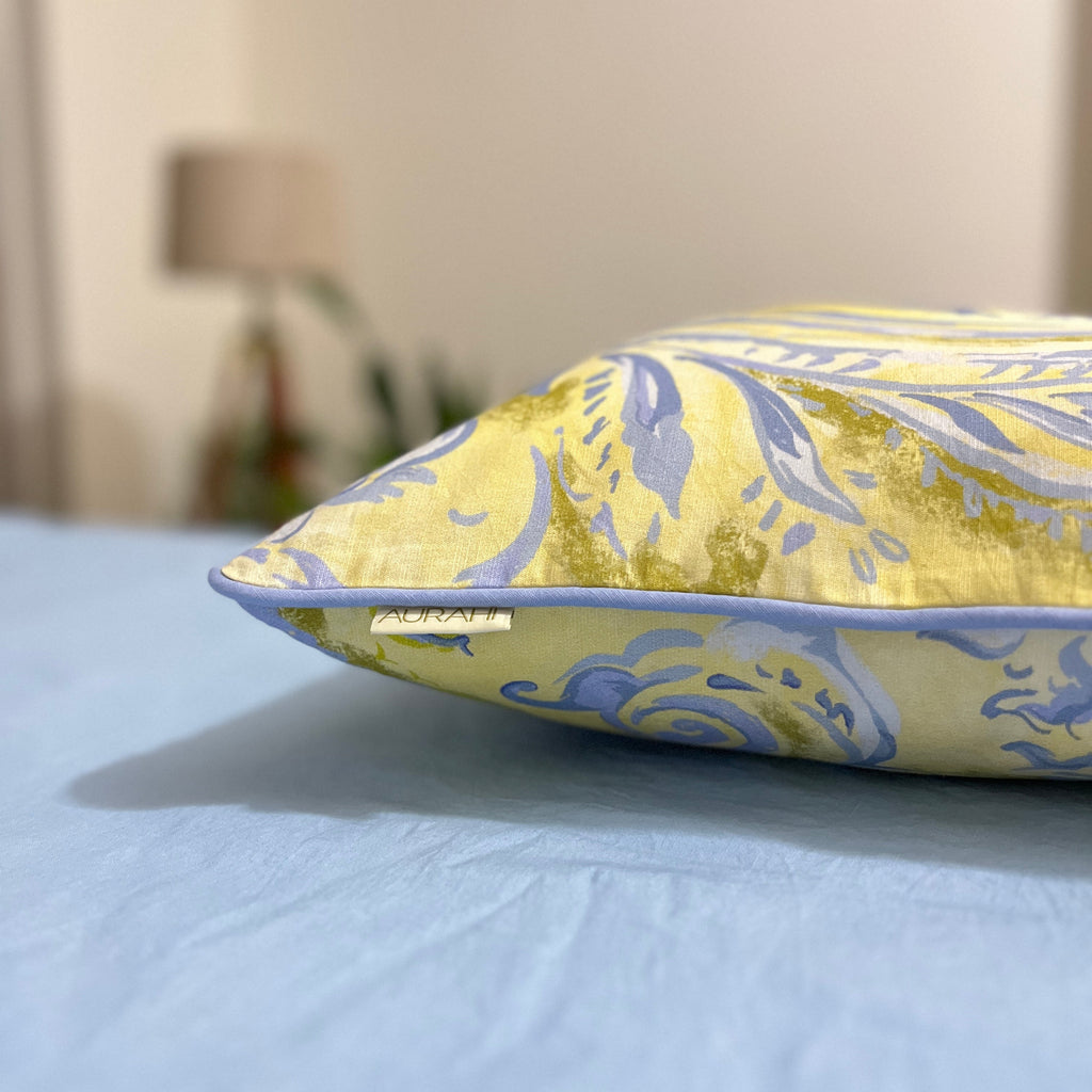 Close-up of the Kava cushion cover highlighting its refined weave and subtle yellow hue.