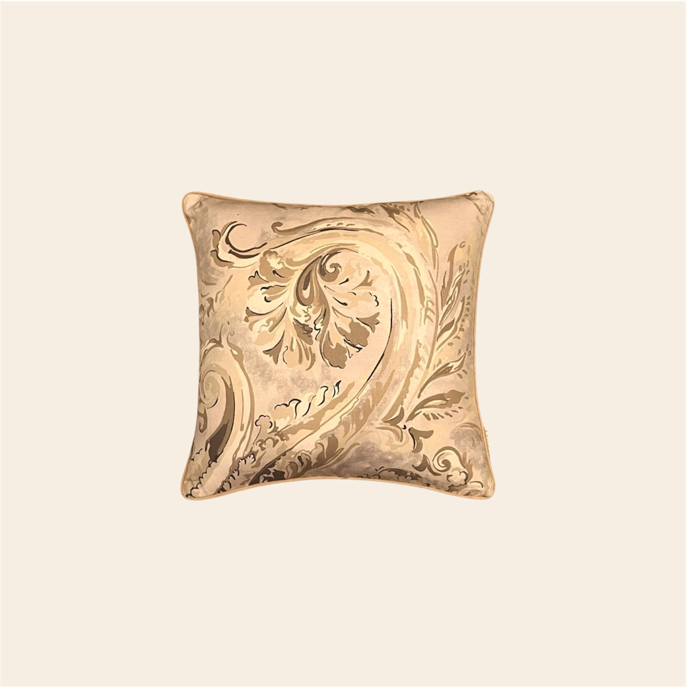 Bhumi cushion cover by Aurahi in earthy beige and sand tones with detailed botanical swirls.