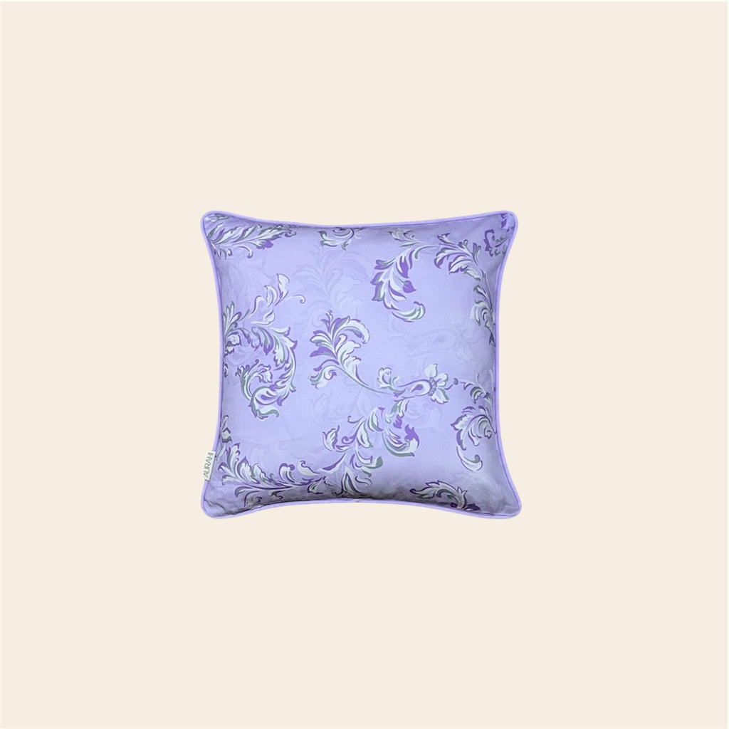 Pankti cushion cover by Aurahi in soft lavender and lilac hues with elegant botanical swirls.